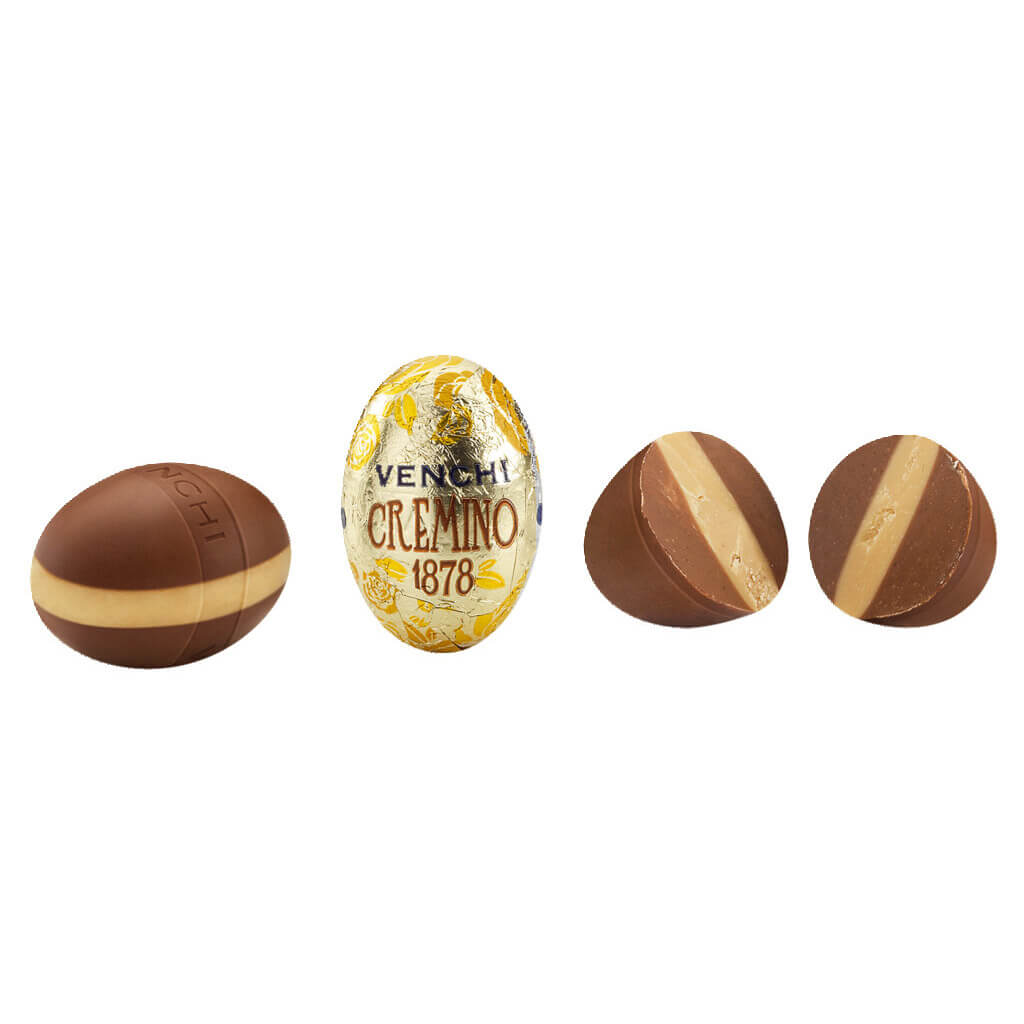 Vier Venchi Ostereier Cremino 1878 mit weißer Schokolade & Gianduia (100 g) - eines in Goldfolie verpackt, drei ausgepackt, um die Füllung aus weißer Schokolade und Gianduia zu enthüllen.