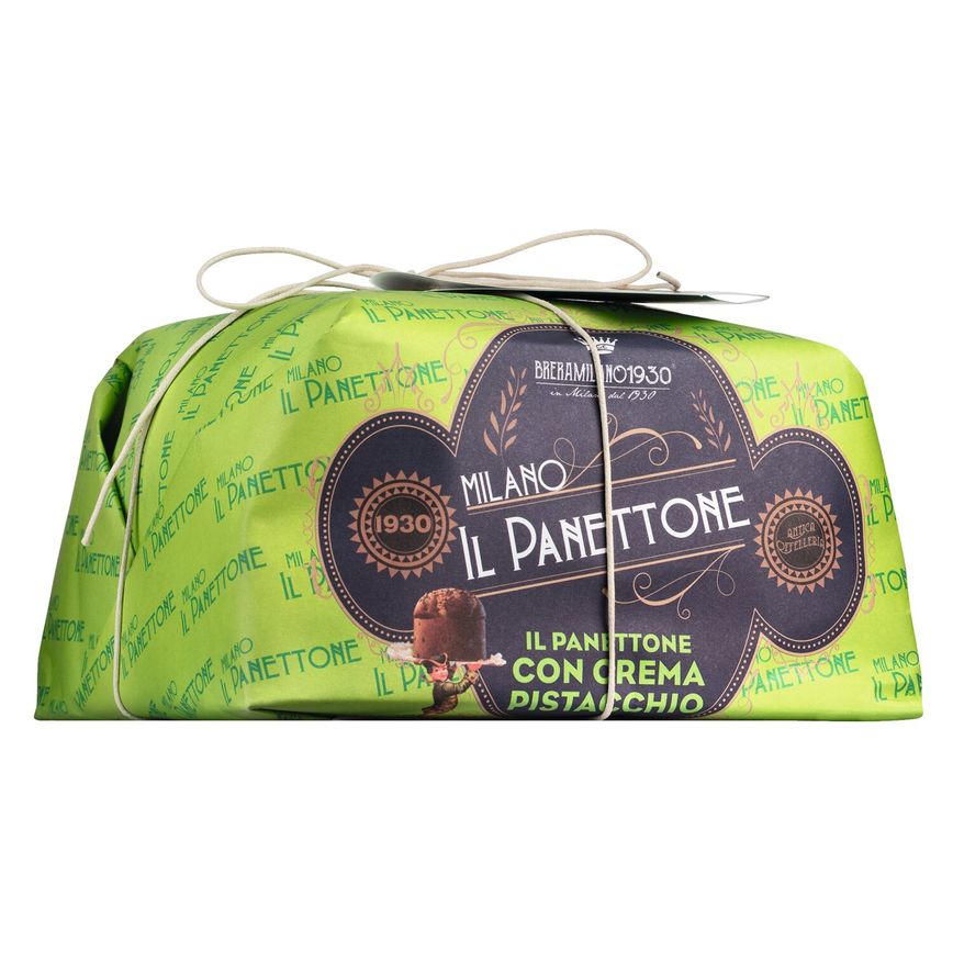 Eine grüne Schachtel Breramilano 1930 Panettone con Crema di Pistacchio, 1 kg-traditioneller italienischer Pistazienkuchen, mit Schnur umwickelt und auf Italienisch beschriftet.
